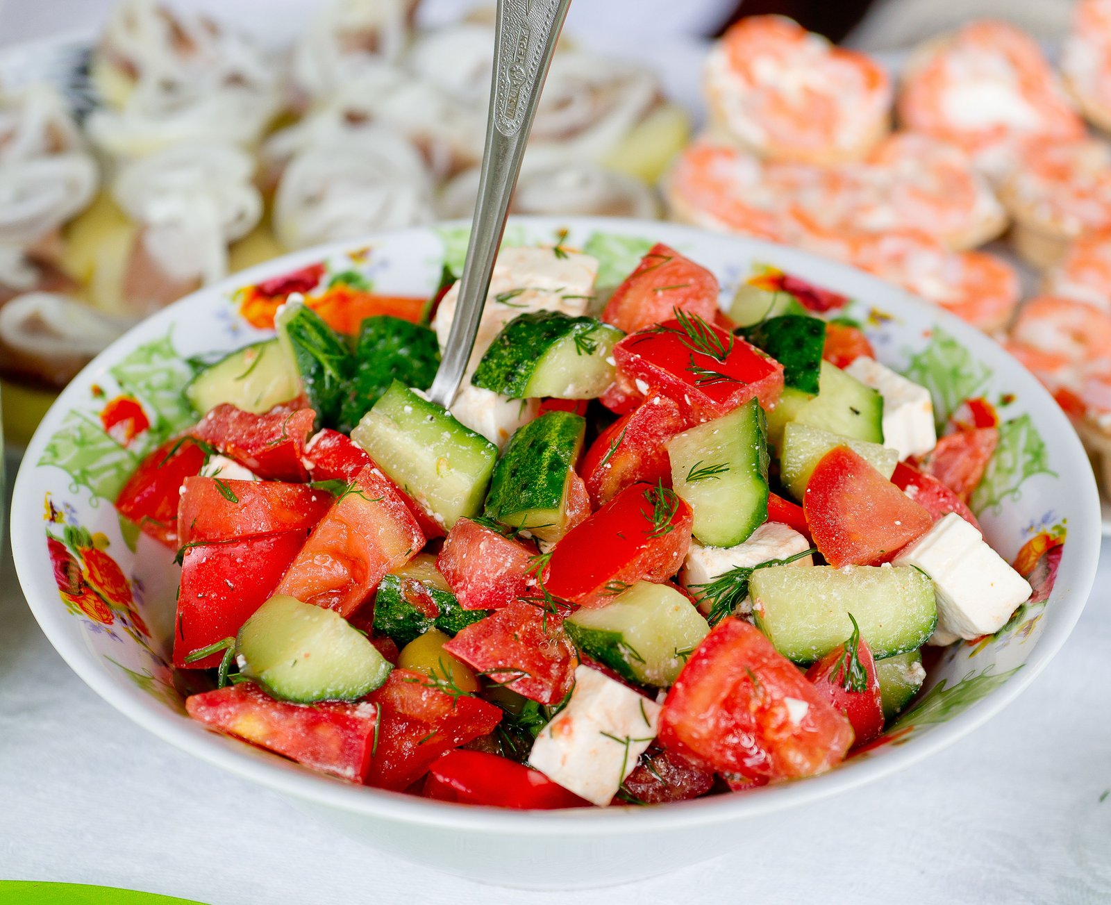 Fresh salad with colourful vegetables and herbs