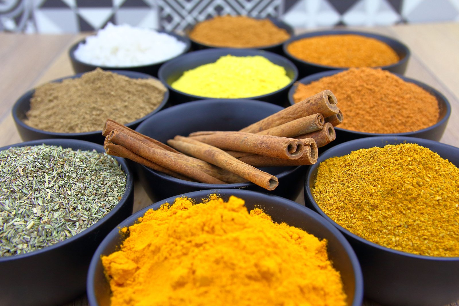 Authentic aromatic spices arranged in bowls